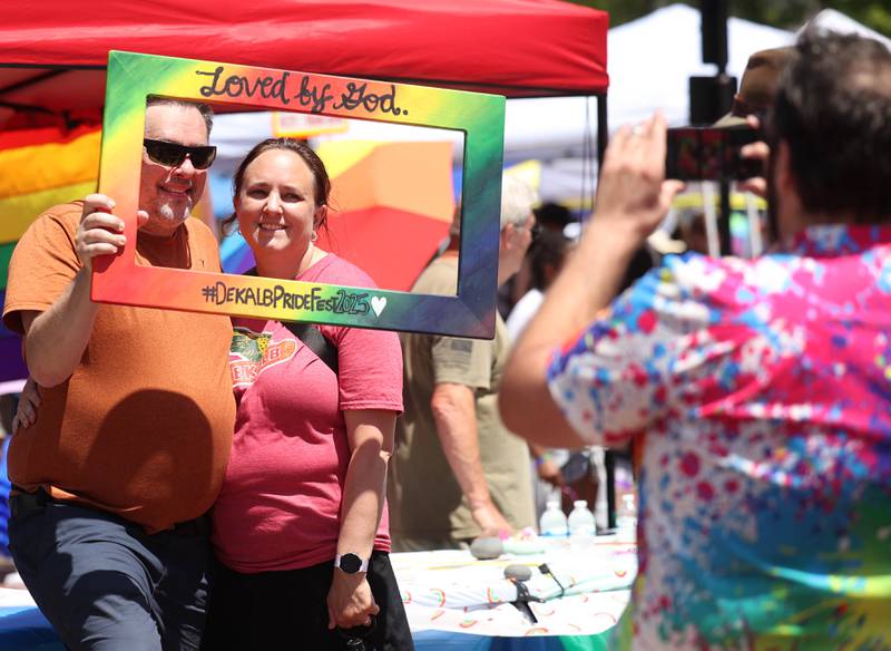 Visitors have their photo taken at one of the booths Saturday, June 21, 2025, during the DeKalb Pride Fest in front of the Egyptian Theatre in DeKalb.