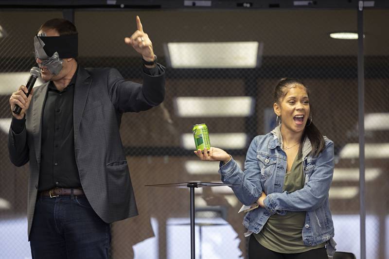 Amazed, Michelle Gutierrez of Amboy reacts to blindfolded mindreader-illusionist Christopher Carter as he successfully identifies a random item plucked from the audience during his performance Wednesday, Nov. 16, 2022, at Sauk Valley Community College.