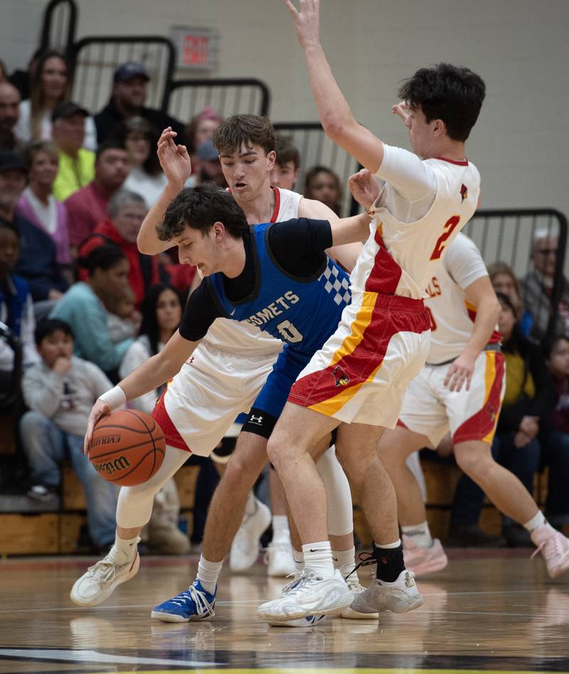 Clifton Central's Derek Meier, center, controls the ball as he is pressured by St. Anne's Jackson Hawkins, left, and Matthew Langellier, right, in the RVC Tournament Championship on Friday, Feb. 13, 2026.