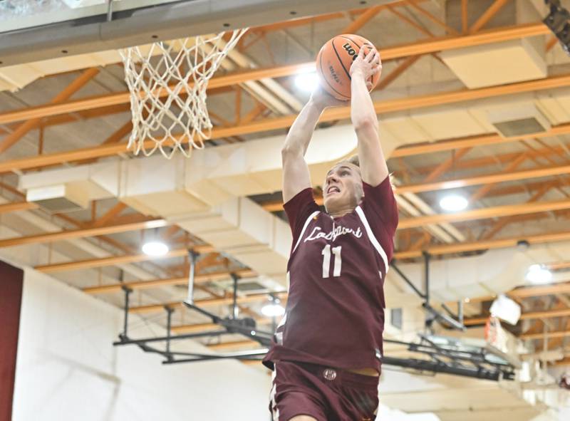 Lockport's Nedas Venckus dunks the ball on a fast break during the WJOL tournament championship game against Lemont on Saturday, NOV. 29, 2025, at Joliet.
