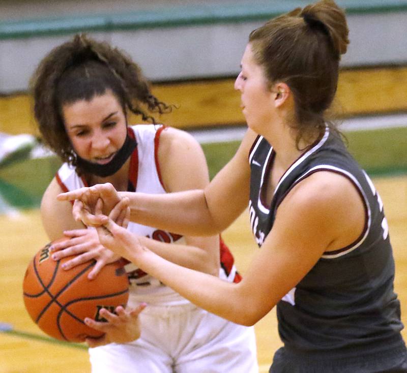 Deerfield's Lexi Kerstein steals the ball from Prairie Ridge's Karsen Karlblom during a IHSA Class 3A Grayslake Central Sectional semifinal basketball game Tuesday evening, Feb. 22, 2022, between Prairie Ridge and Deerfield at Grayslake Central High School.