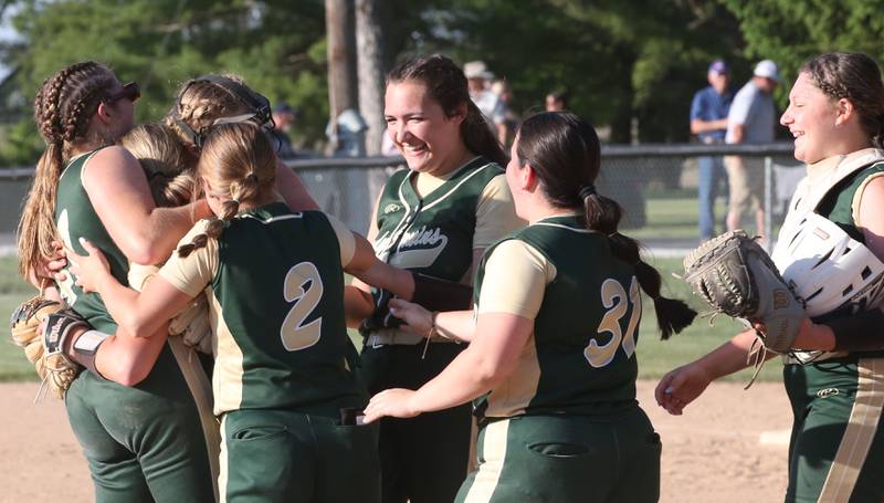 Members of the St. Bede softball team celebrate after winning the Class 1A Sectional title after defeating Biggsville 3-1 in the Class 3A Sectional championship on Friday, May 26, 2023 at St. Bede Academy.
