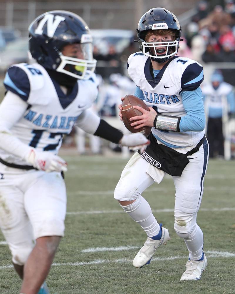 Nazareth's Logan Malachuk looks for a receiver in the Sycamore secondary Saturday, Nov. 18, 2022, during their state semifinal game at Sycamore High School.