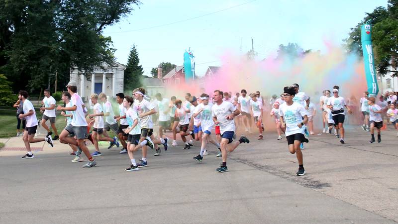 Runners sprint out of the starting line during the Arukah Institute of Healing Freedom Color Run on Friday, July 4, 2025 at Soldiers and Sailors Park in Princeton.