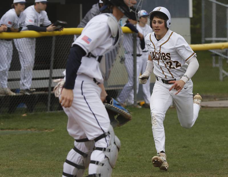Jacobs' Luke Gormsen runs to score Jacobs second run during a Fox Valley Conference baseball game against Cary-Grove on Wednesday, April 17, 2024, at Cary-Grove High School. The game was stopped for darkness after the 9th inning with the score tied 6-6.