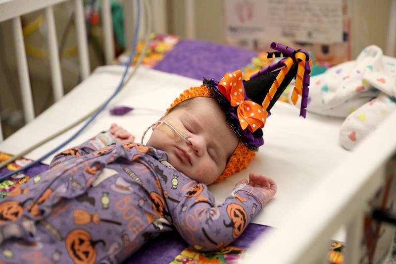 Sophia Ameti dresses in her witch hat during Halloween in the neonatal intensive care unit of Northwestern Central DuPage Hospital in Winfield on Tuesday, Oct. 31, 2023.