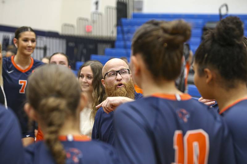 Oswego head coach Gary Mosley addresses the team after winning their Class 4A Regional Final volleyball match against Neuqua Valley. Oct 30, 2025 in Plainfield.