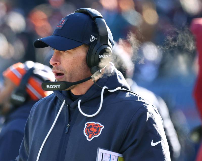 Chicago Bears head coach Ben Johnson talks into his headset during their game against the Cleveland Browns Sunday, Dec. 14, 2025, at Soldier Field in Chicago.