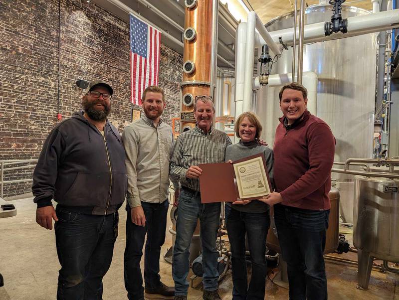 State Rep. Bradley Fritts (right) presents a Business Spotlight award to Adam Kennay (from left), Kaleb Kennay, Rick Kennay and Doris Kennay,