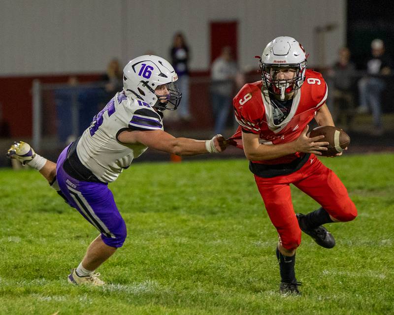 Sam Lerette (9) of Streator runs ball with Brady Lawrence (16) of Dixon attached to his jersey on Friday, October 17, 2025 at Streator High School in Streator.