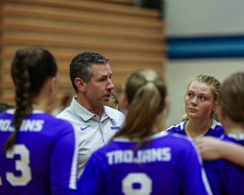 Downers Grove North's head coach Mark Wasik instructs the team during a timeout in their volleyball match versus Downers Grove North.  Sept 7, 2023.