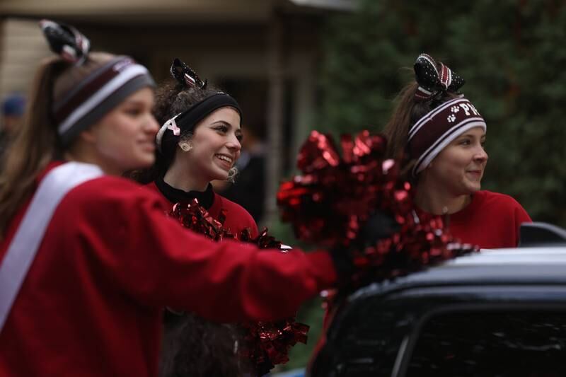 Plainfield North High School Cheer Team rides in the 70th Annual Plainfield Homecoming Parade. Saturday, Oct. 8, 2022, in Plainfield.