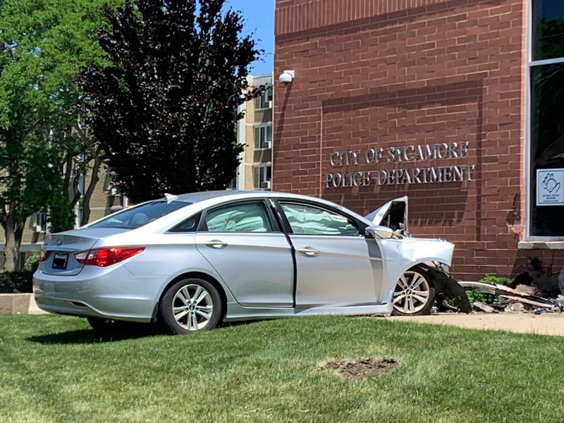 A car crashed into the Sycamore Police Department on DeKalb Avenue Wednesday morning, May 26, 2021. Police are investigating, and the cause of the crash remains unknown at this time.