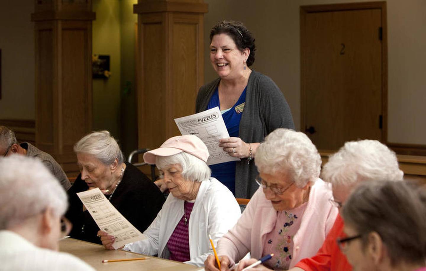 When the games end, McCluskey often gives participants a crossword puzzle they can work on during the week. They're free to see McCluskey for the answers during the week or at the next session.

"We had one [crossword puzzle] that was all three-letter words," McCluskey said. "It was very difficult."

Music is another tool to help keep memory sharp, one reason why The Timbers offers so many music-related programs: ballroom dances, musical performers and the monthly "Music and Movement" class which works the lung, heart, and encourages reminiscing.

"Music is one of the biggest memory triggers there is," McCluskey said. "When the music plays, it's nice to see them sing along because they know every word."

Another focus on is the "Optimizing Brain Fitness." Instead of mental exercise, this discussion-based classes focuses on ways to foster and preserve brain health, Mc Cluskey said.

"For example, making sure you're getting enough exercise to stimulate your brain and body and watching food and calorie intake to stay healthy," McCluskey said.

Linda McCluskey, director of activities, leads the "Academy for Seniors" at the Timbers of Shorewood Friday, June 08, 2018, in Shorewood, Ill.