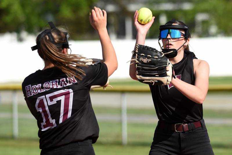 Watseka's Lilly Kingdon, right, is congratulated by Christa Holohan after recording an out during a game at Grant Park Wednesday, April 22, 2026.