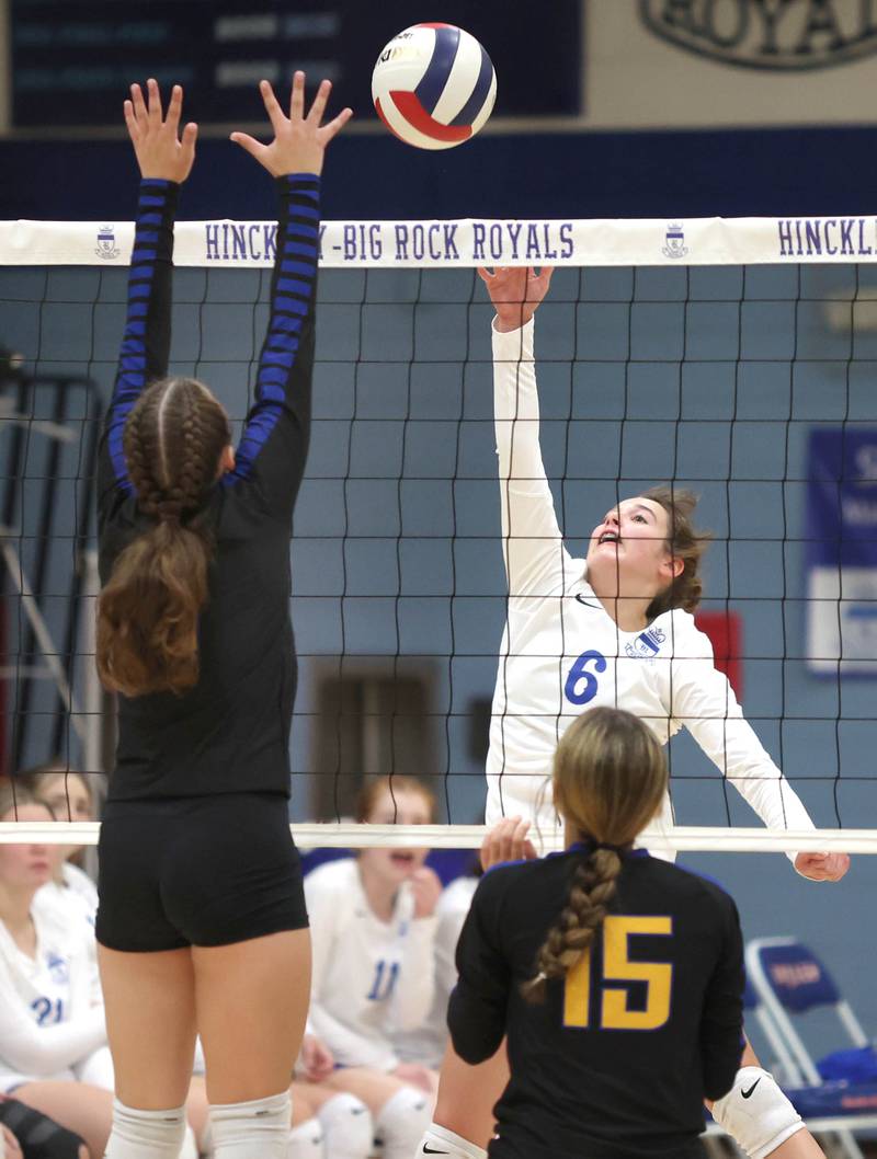 Hinckley-Big Rock's Courtlyn Brockway tries to tip the ball over a Somonauk blocker during their match Thursday, Sept. 15, 2022, at Hinckley-Big Rock High School.