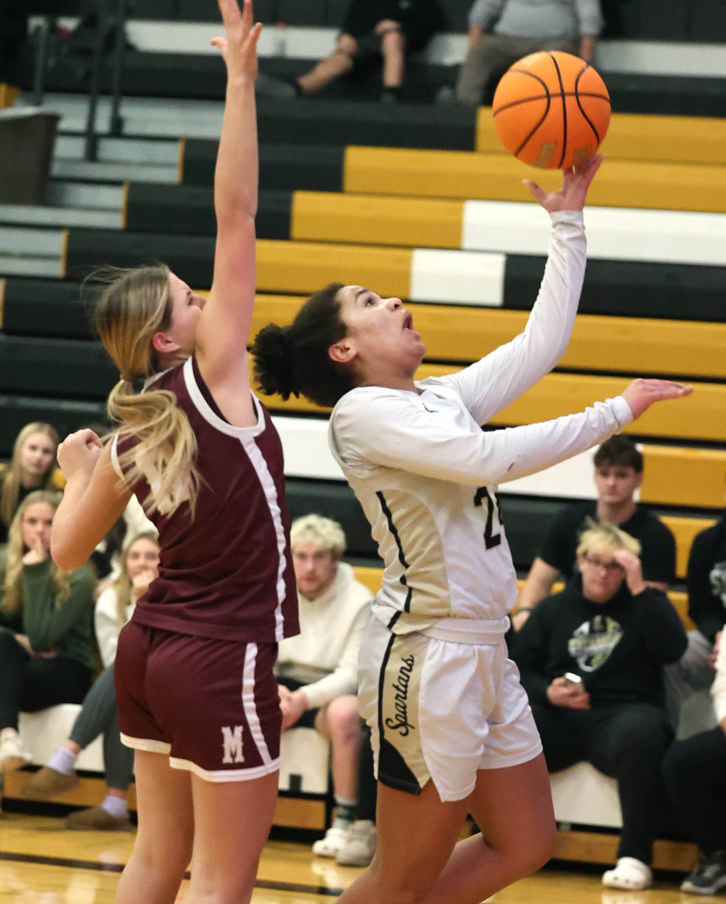 Sycamore's Monroe McGhee gets a shot up in front of Morris’ Alyssa Jepson during their game Tuesday, Jan. 23, 2024, at Sycamore High School.