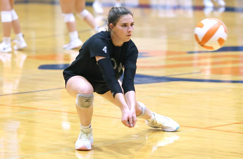 Genoa-Kingston's Hannah Langton digs a ball Tuesday, Aug. 23, 2022, during volleyball practice at the school in Genoa.