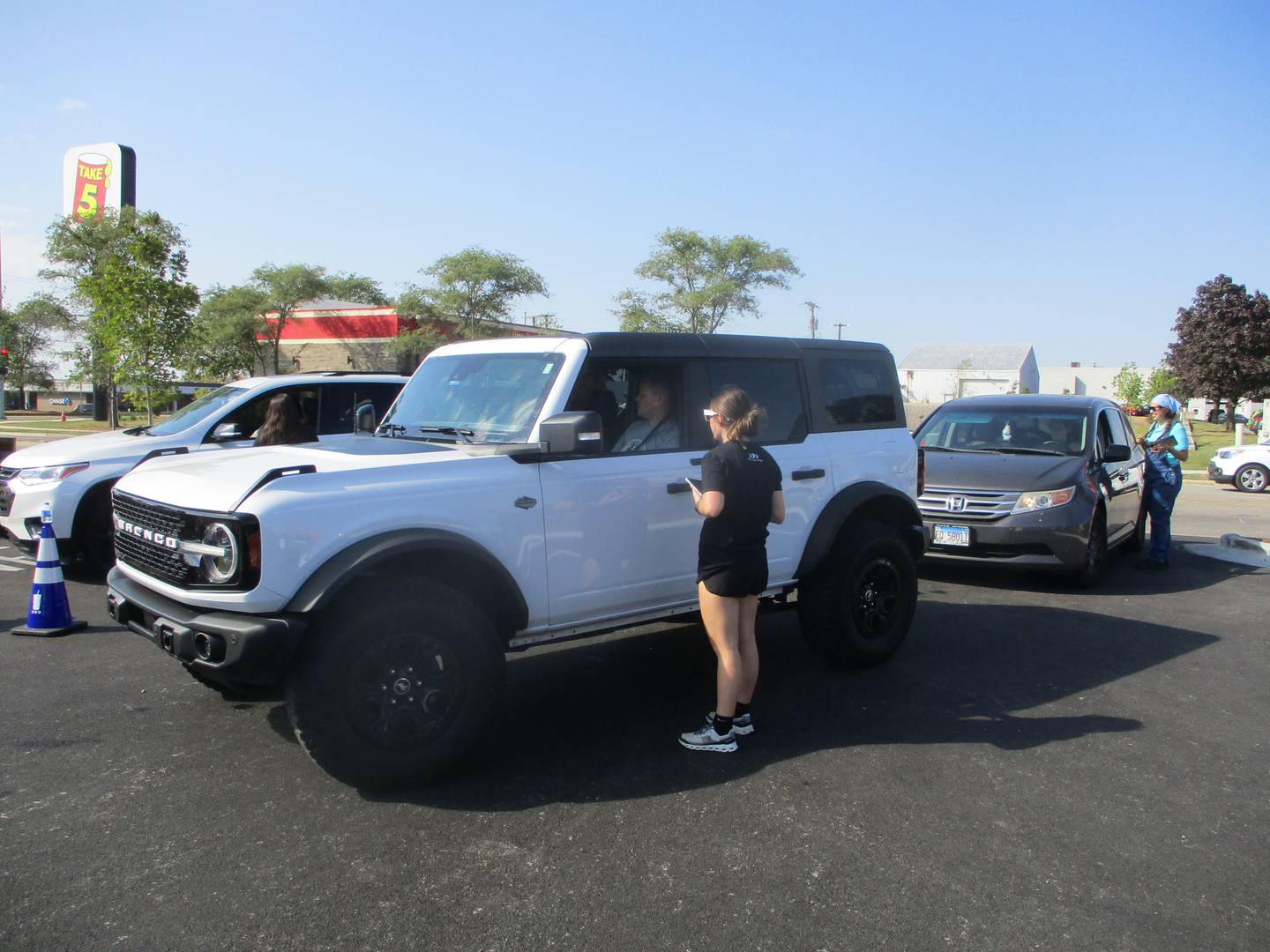 Attendants at the new 7 Brew in Joliet take orders on Saturday as vehicles pull into the business at Jefferson Street and Barney Drive. Oct. 4, 2025