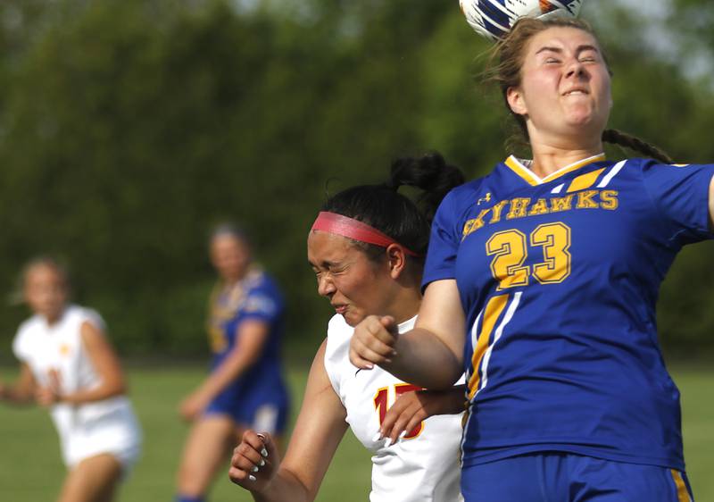 Johnsburg's Kiara Welch heads the ball away from Richmond-Burton's Brianna Maldonado during the IHSA Class 1A Marian Central Sectional Championship match on Tuesday, May 21, 2024, at Marian Central High School.