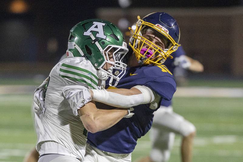 Sterling’s Joseph Duffy hauls down Alleman’s Adam VanMeighem Friday, Oct. 3, 2025.