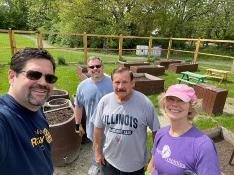 Members from the Rotary Club of Joliet volunteered at the Joliet chapter of the National Hook-Up of Black Women's community garden. Pictured (from left) are Pete Colarelli, Paul Schrik, Mark Griglione and Jane Condon.