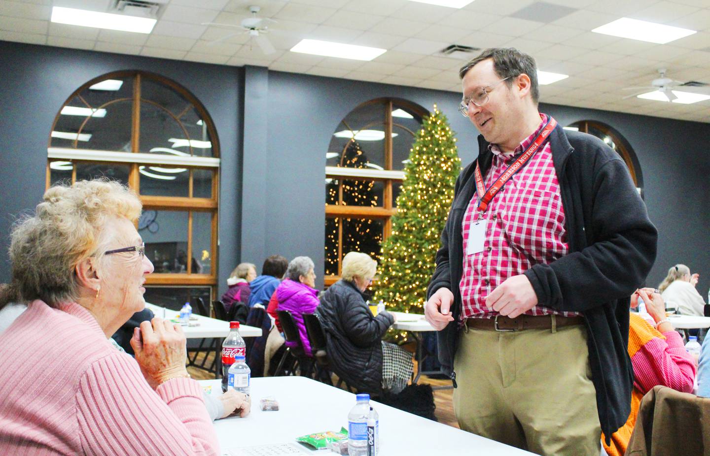 Morrison High School Key Club advisor Brian Bartoz chats with a participant during the club's monthly Golden Ages Bingo event at Odell Public Library on Jan. 15, 2026. The free event for seniors 55 years or older offers gift bag prizes and plenty of treats to eat during play.