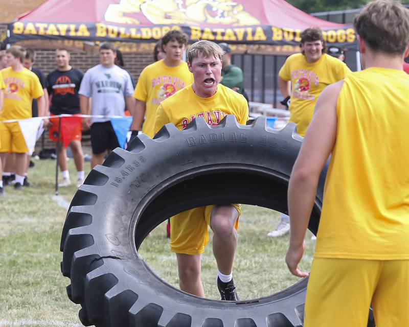 Batavia's Jackson Garrett participates in the Tractor Tire Relay Race during the West Aurora "Battle of the Butts" Lineman Challenge, July 10, 2025  in Aurora.