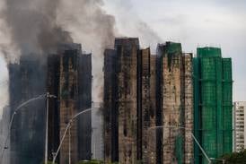 At least 94 dead as Hong Kong firefighters battle burning towers for a second day
