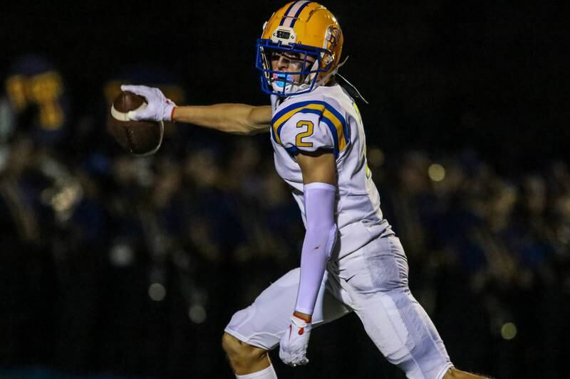 Lyon's Travis Stamm (2) runs in a touchdown reception during football game between Hinsdale Central at Lyons.  Sept 8, 2023.