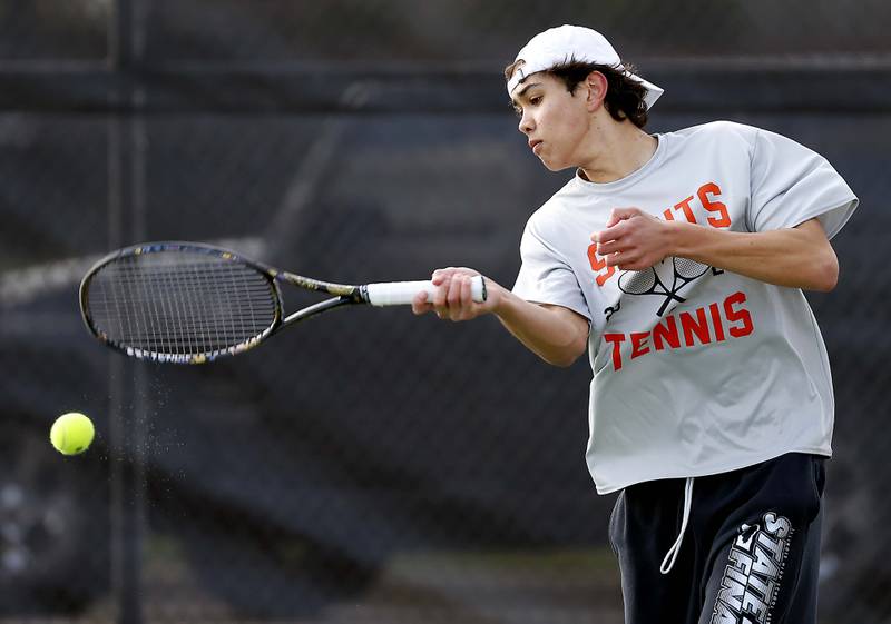 St. Charles East's Tiernan Price plays Saturday, April 20, 2024 at the St. Charles East Varsity Tennis Invitational.