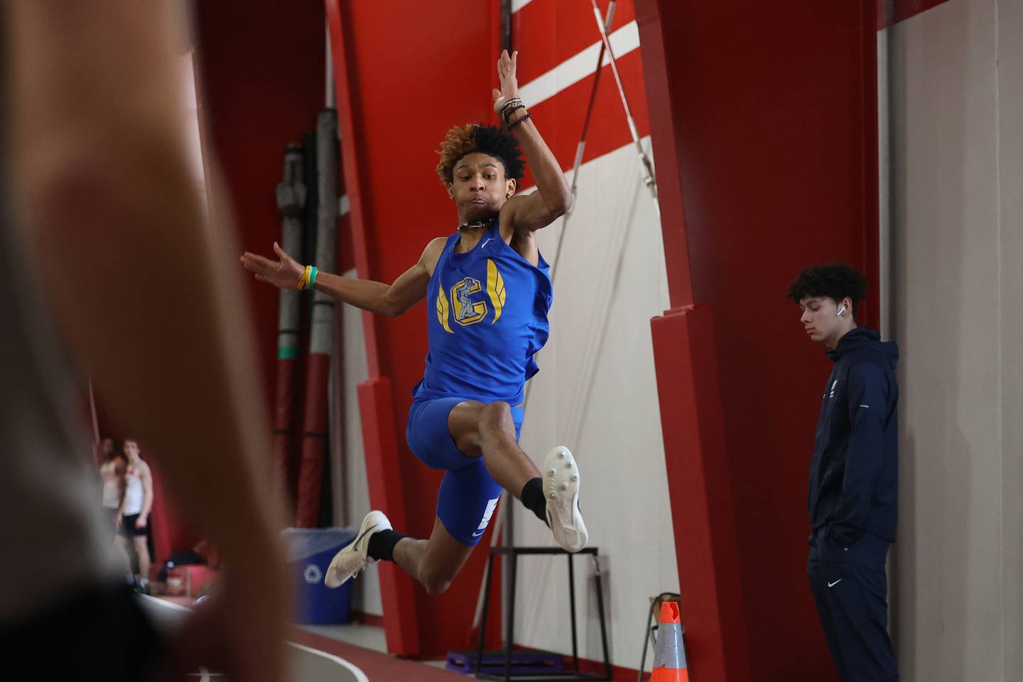 Joliet Central’s Jamari Straughter competes in the long jump the Southwest Prairie Conference indoor track and field championship at Lewis University in Romeoville.