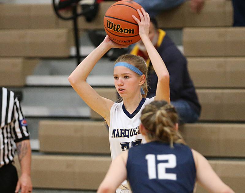 Marquette's (33) looks to pass the ball against Fieldcrest's Haley Carver in the Integrated Seed Lady Falcon Basketball Classic on Thursday, Nov. 17, 2022 in Flanagan.