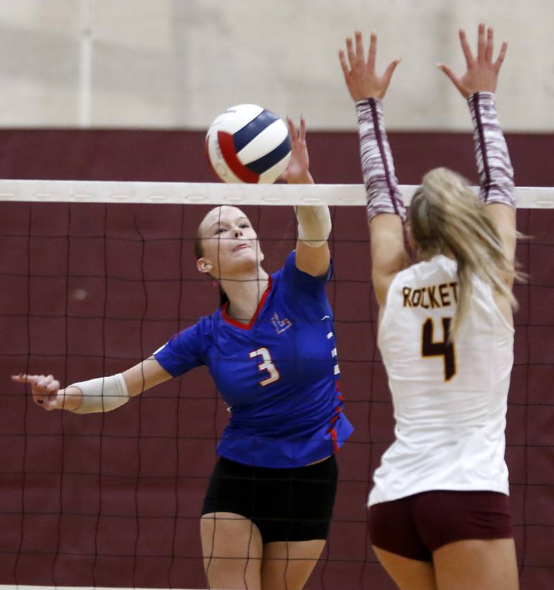 Lakes’ Ray Sundquist hits the ball past Richmond-Burton's Daniella Hopp during a nonconference volleyball match on Monday, Sept. 29, 2025, at the Richmond-Burton High School in Richmond.