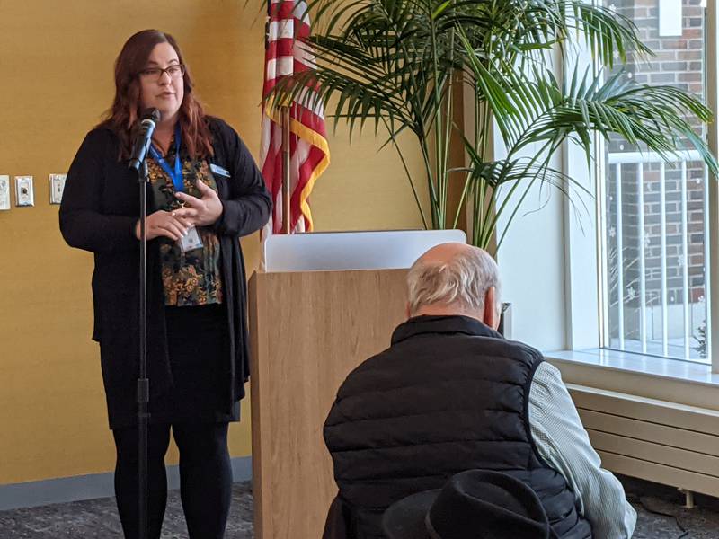 St. Charles Library Director Kate Buckson speaks to those who attended an open house Sunday at the library.