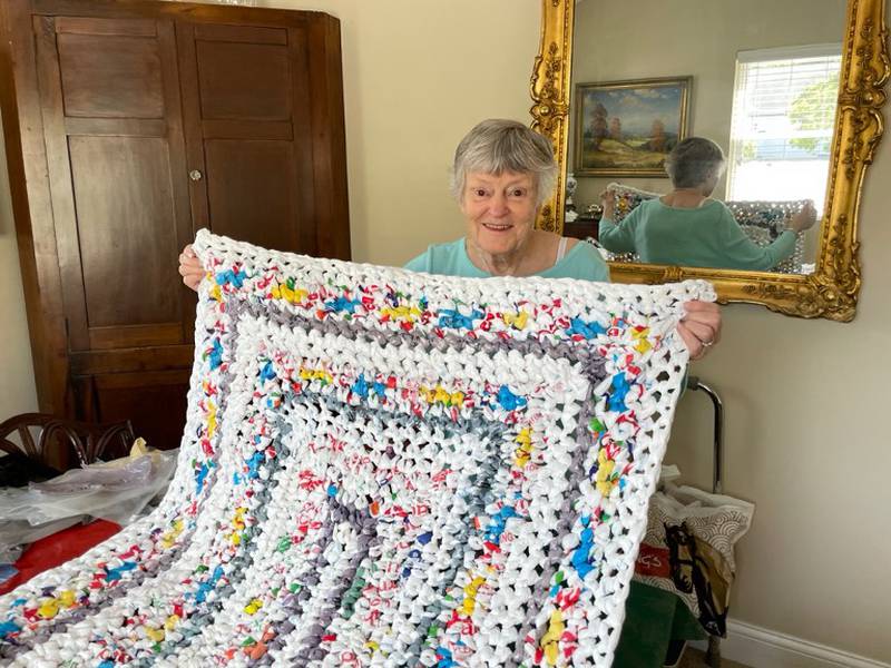Oak Trace resident Libby Bolton makes recycled mats for the homeless. Downers Grove