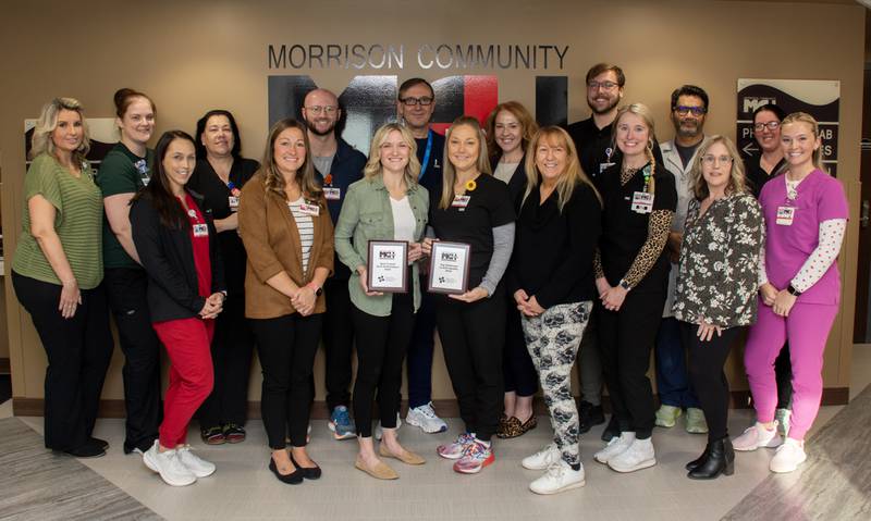 Providers and nurses from Morrison Community Hospital pose with their two awards Best Overall for both Quality and Annual Wellness Visits and Best in Quality award (co-winner) based on Illinois Rural Community Care Organization evaluations on Morrison's 2024 work.