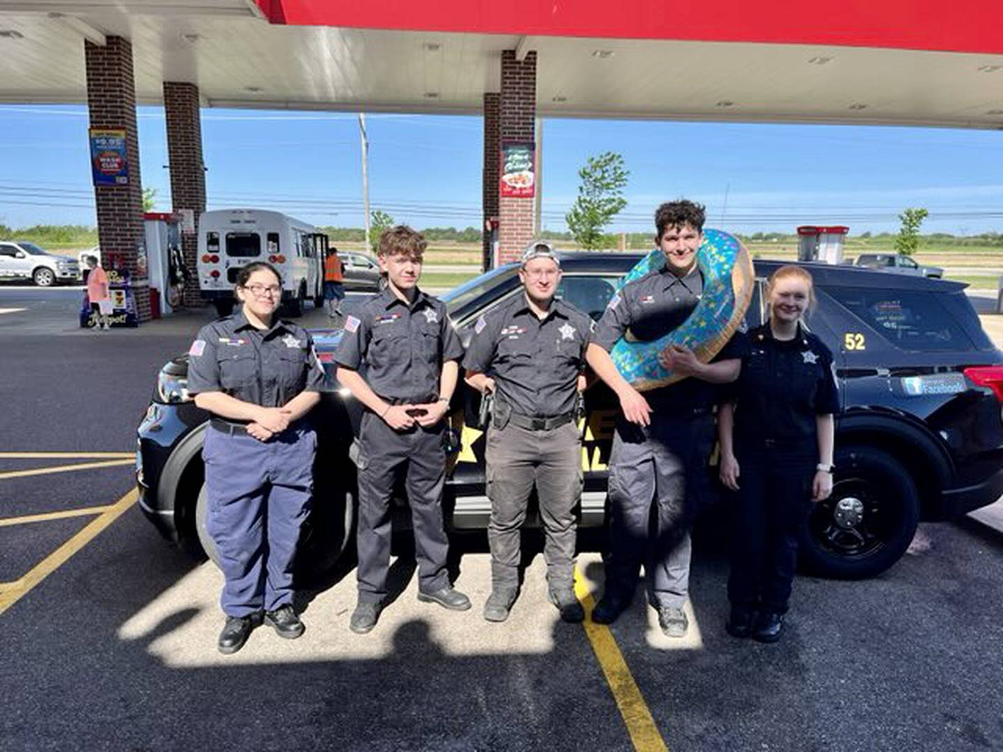 Members of the Kendall County Sheriff's Office gather before climbing to the rooftop on the Dunkin' in Yorkville and Plano to raise funds for the Special Olympics of Illinois.