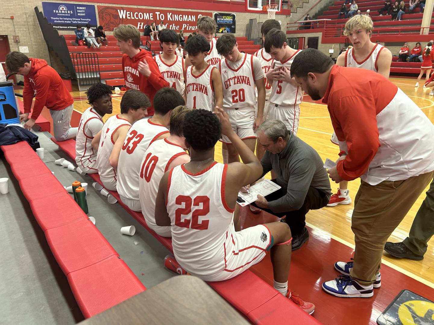 Ottawa coach Mark Cooper coaches up his team during a huddle in Tuesday's game at Kingman Gymnasium. He tied Dean Riley for most coaching wins in program history with 332. Cooper played for Riley at IVCC.