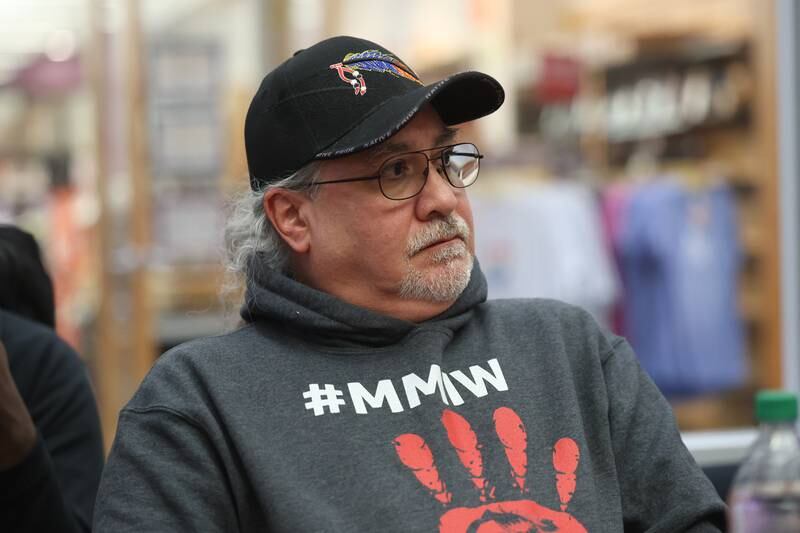 Ted Turjillo, of the Passamaquoddy tribe and Native American activist, listens to Joseph “Standing Bear” Schranz, from the Ojibwa tribe at White Earth reservation in Minnesota, speak at a round table discussion on the destructive and dehumanization of Native American culture and their people at Joliet Junior College on Thursday, Nov. 9, 2023 in Joliet.