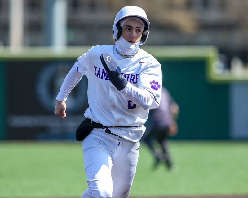 Hampshire's Calen Scheider (27) pulls up a third during baseball game between Dixon at Hampshire.  March 28, 2024