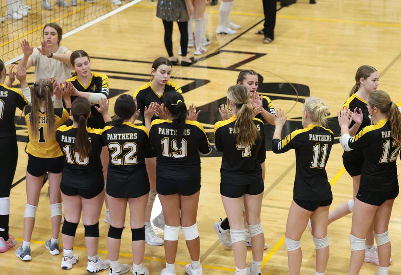 Members of the Putnam County volleyball team hi-five each other after loosing to Orion in the Class 1A Regional final on Thursday, Oct. 30, 2025 at Putnam County High School.