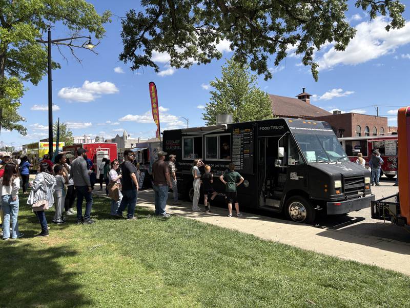 A line of more than 20 people forms at The Culinary Gangster food truck during the Streator Food Truck Festival on Saturday, May 17, at City Park.
