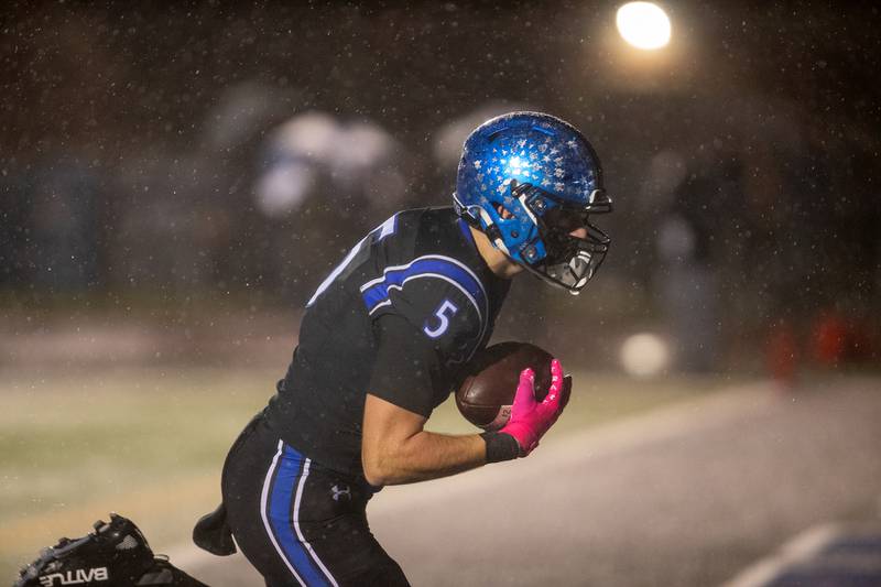 St. Charles North's Braden Harmes makes the running catch for a touchdown against Carmel at the Class 7A Second Round playoff game on Saturday, Nov.8,2025 in St. Charles.