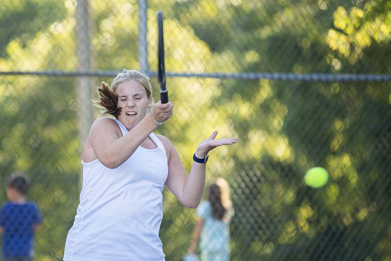 Sterling’s Ellie Aitken returns a shot to Dixon’s Addison Arjes Thursday, Sept. 29, 2022.