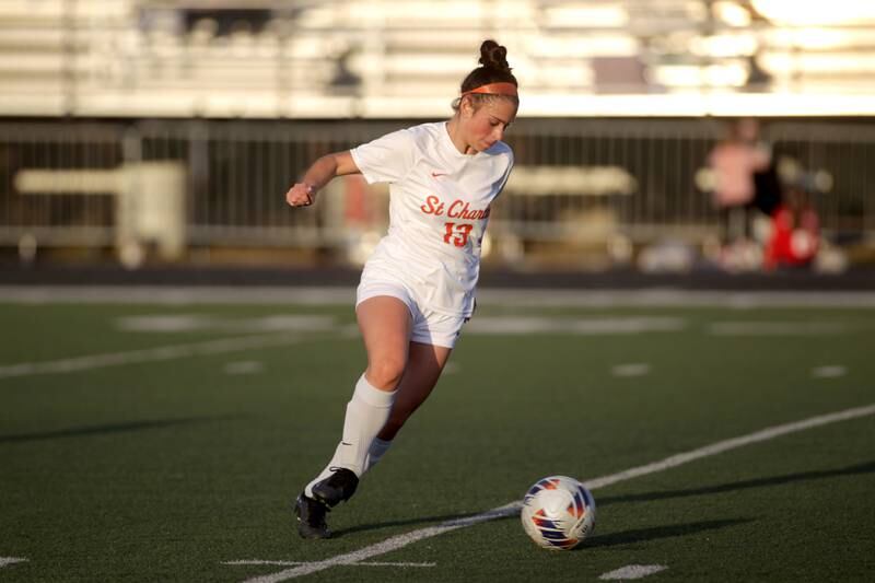 St. Charles East’s Georggia Desario gets control of the ball during a game at Wheaton Warrenville South on Tuesday, April 18, 2023.