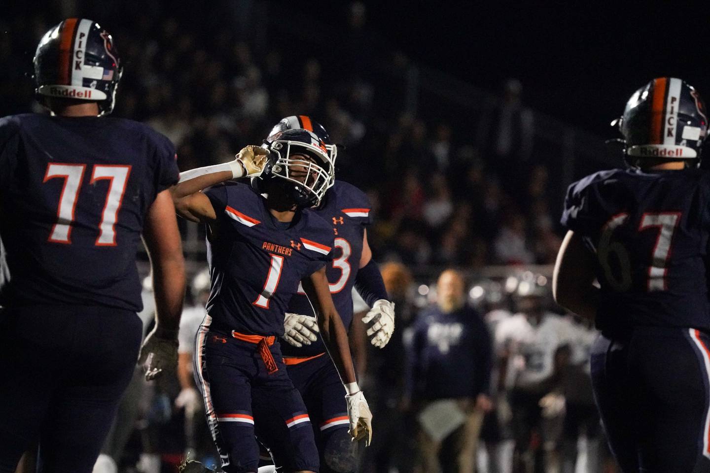 Oswego’s Jeremiah Cain (1) reacts after scoring a touchdown against Oswego East during a football game at Oswego High School on Friday, Oct. 20, 2023.