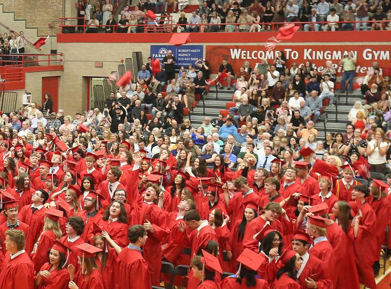 Ottawa High School Class of 2026 graduates throw caps in the air after graduating during the commencement ceremony in Kingman Gymnasium on Friday, May 22, 2026 at Ottawa High School