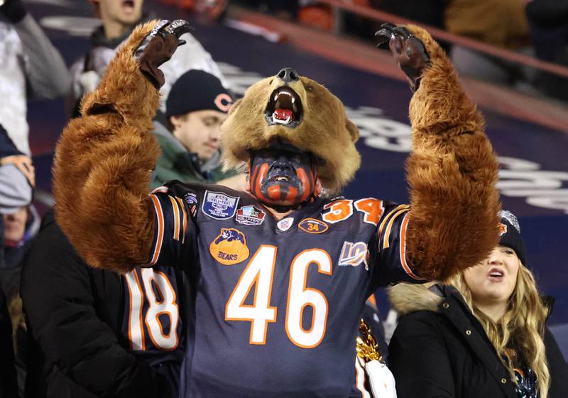 Don Wachter, of Plainfield, cheers on the Bears dressed in his Bearman costume Saturday, Jan. 10, 2026, during the Chicago Bears NFL Wild Card game against the Green Bay Packers.