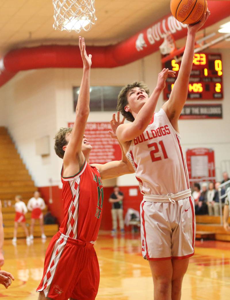 Streator's Brenen Stillwell scores on a layup over L-P's Jameson Hill on Tuesday, Jan. 13, 2026 in Pops Dale Gymnasium at Streator High School.